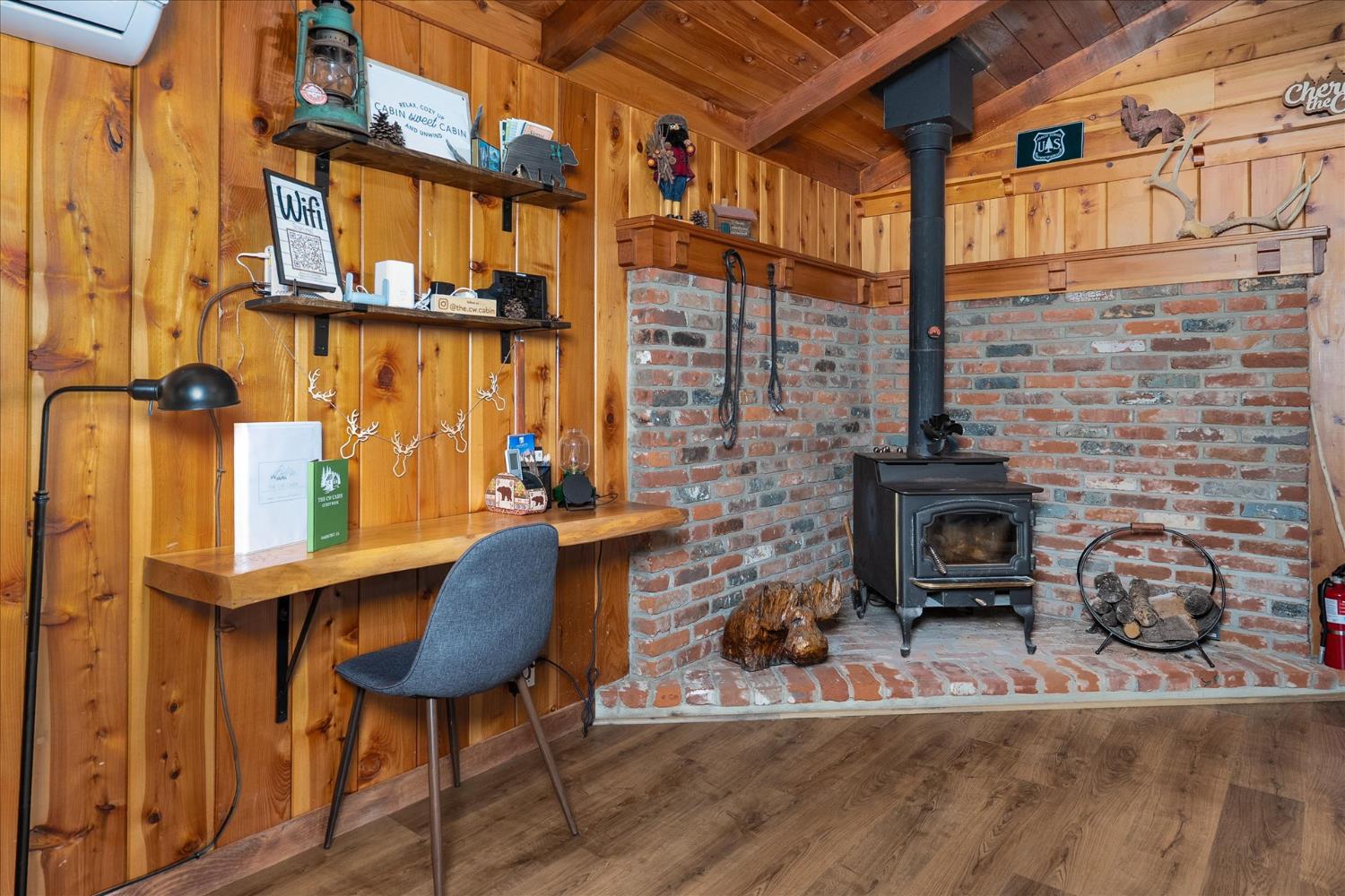 44800 Mountain Meadow Road Oakhurst, CA 93644 - Photo 22 of 41 a view of balcony with furniture and a fireplace
