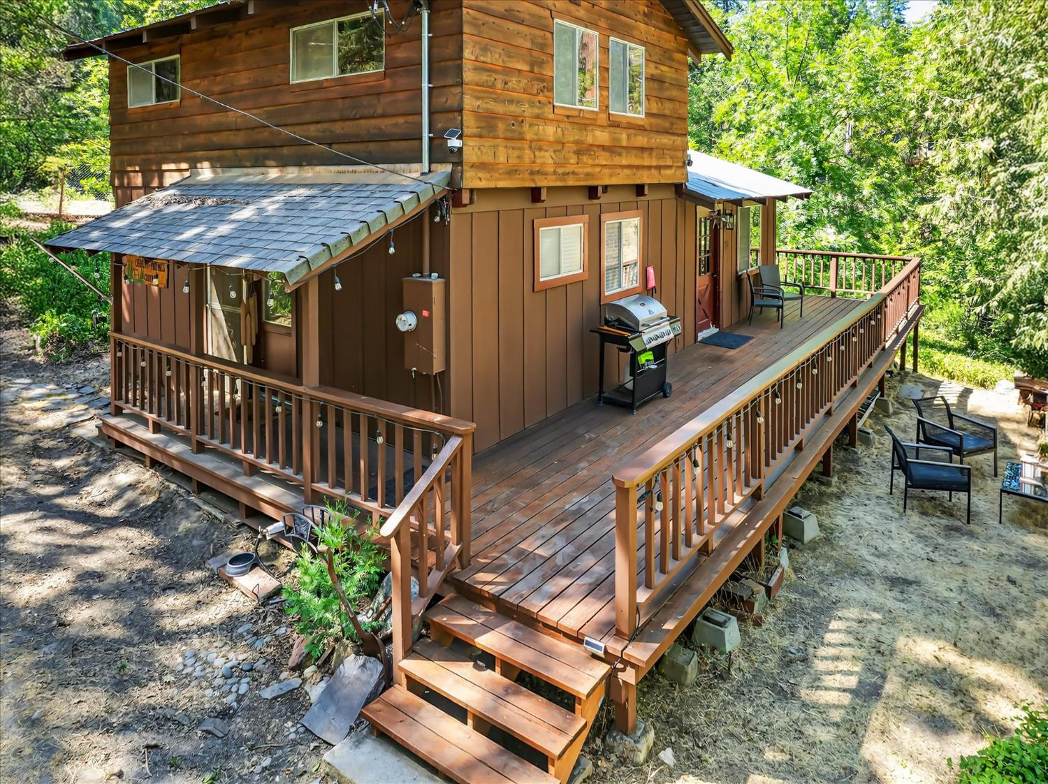 44800 Mountain Meadow Road Oakhurst, CA 93644 - Photo 26 of 41 a view of a house with wooden deck