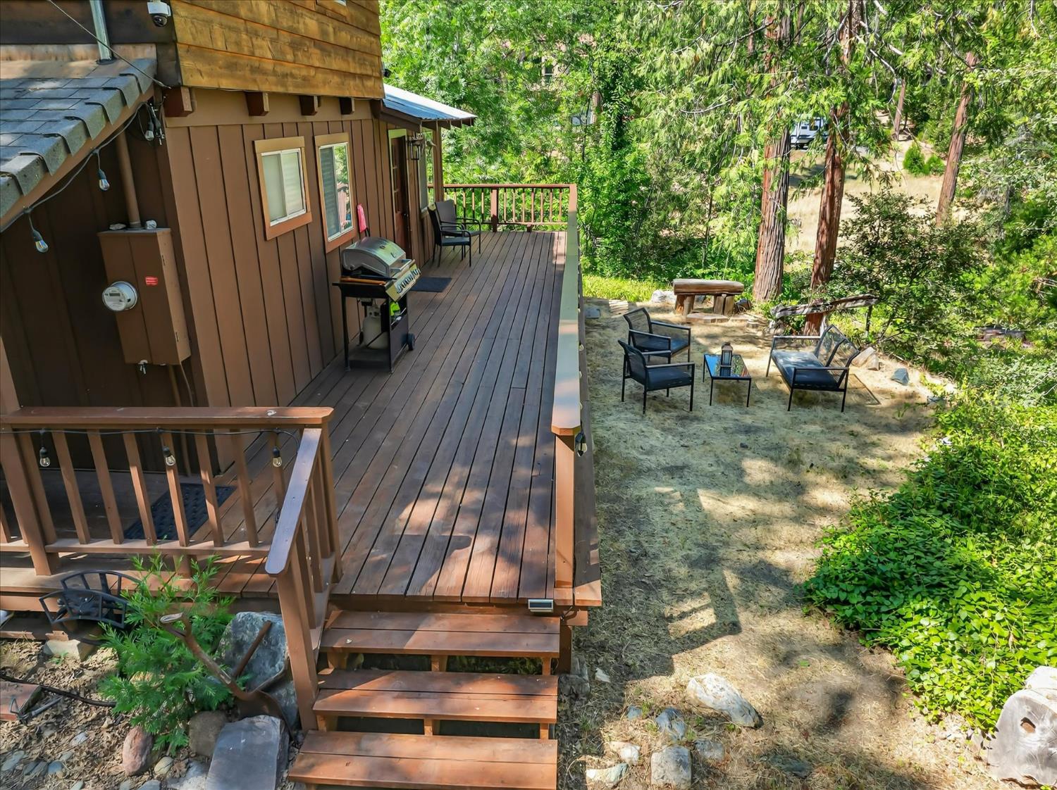 44800 Mountain Meadow Road Oakhurst, CA 93644 - Photo 29 of 41 a view of a house with backyard and sitting area