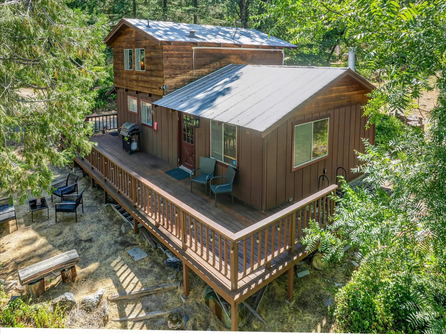 44800 Mountain Meadow Road Oakhurst, CA 93644 - Photo 30 of 41 a view of a house with roof deck front of house