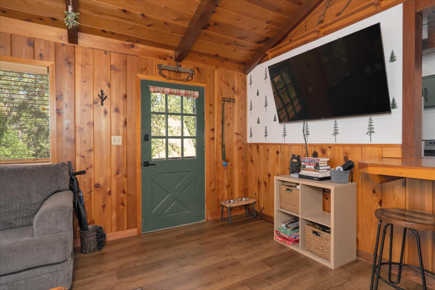 44800 Mountain Meadow Road Oakhurst, CA 93644 - Photo 3 of 41 a view of livingroom with furniture and flat screen tv
