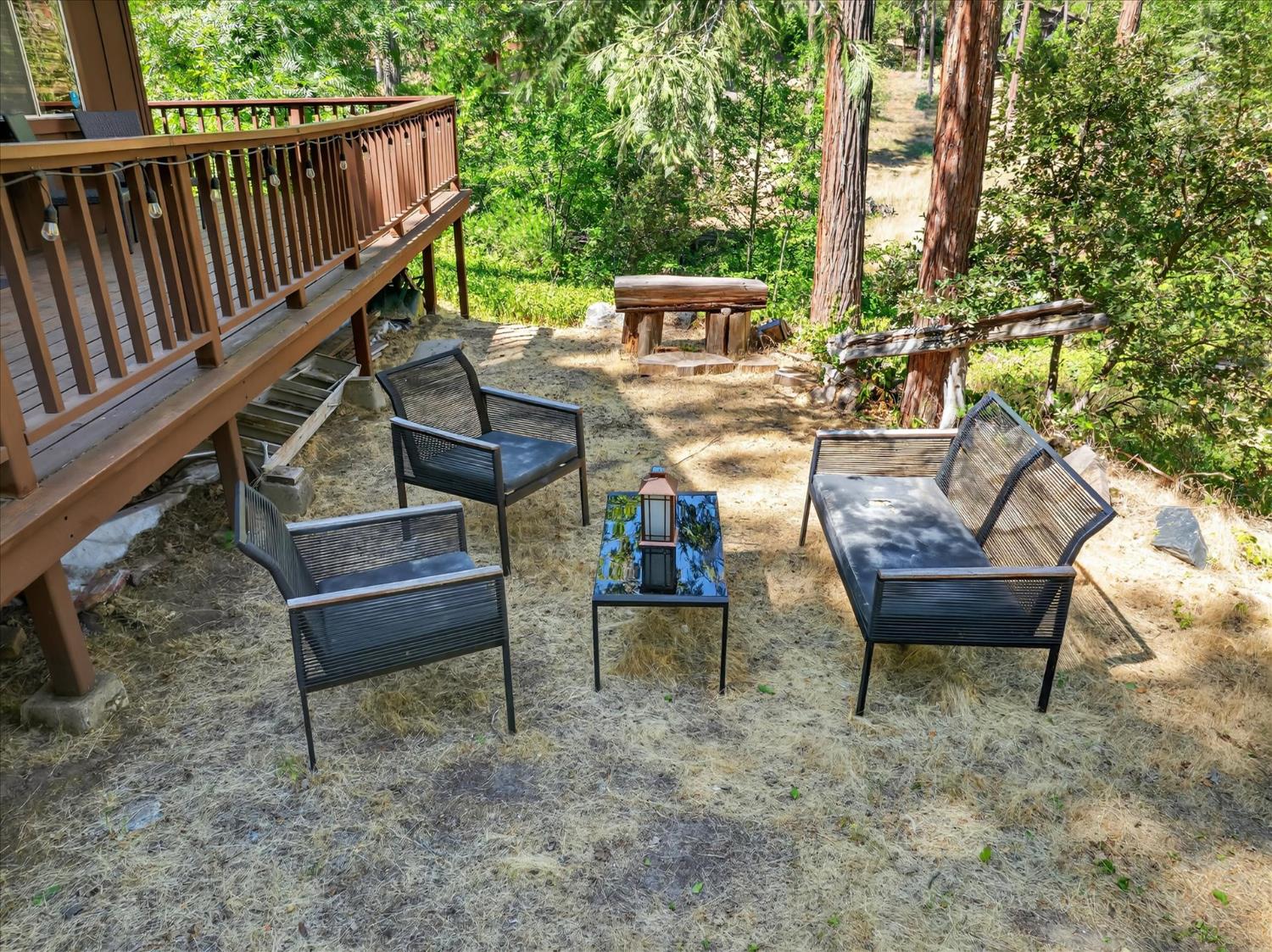 44800 Mountain Meadow Road Oakhurst, CA 93644 - Photo 33 of 41 a view of a backyard with sitting area