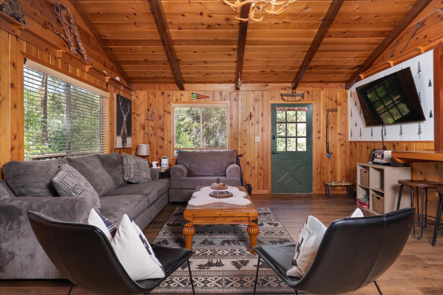 44800 Mountain Meadow Road Oakhurst, CA 93644 - Photo 4 of 41 a living room with furniture a flat screen tv and a window