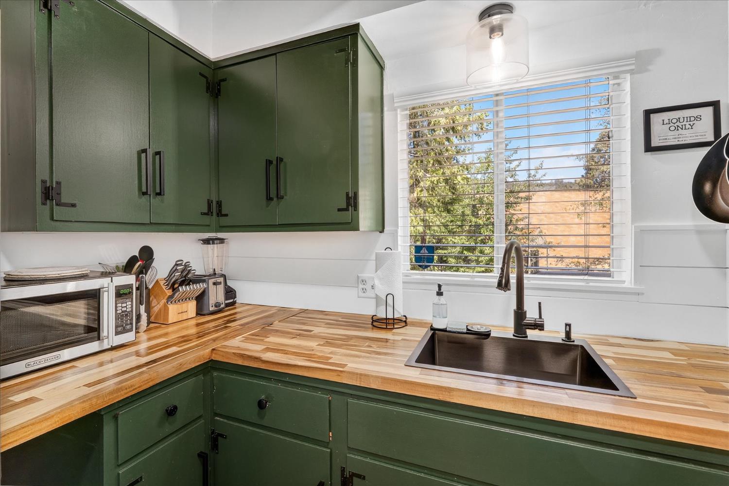 44800 Mountain Meadow Road Oakhurst, CA 93644 - Photo 6 of 41 a kitchen with a sink and a window
