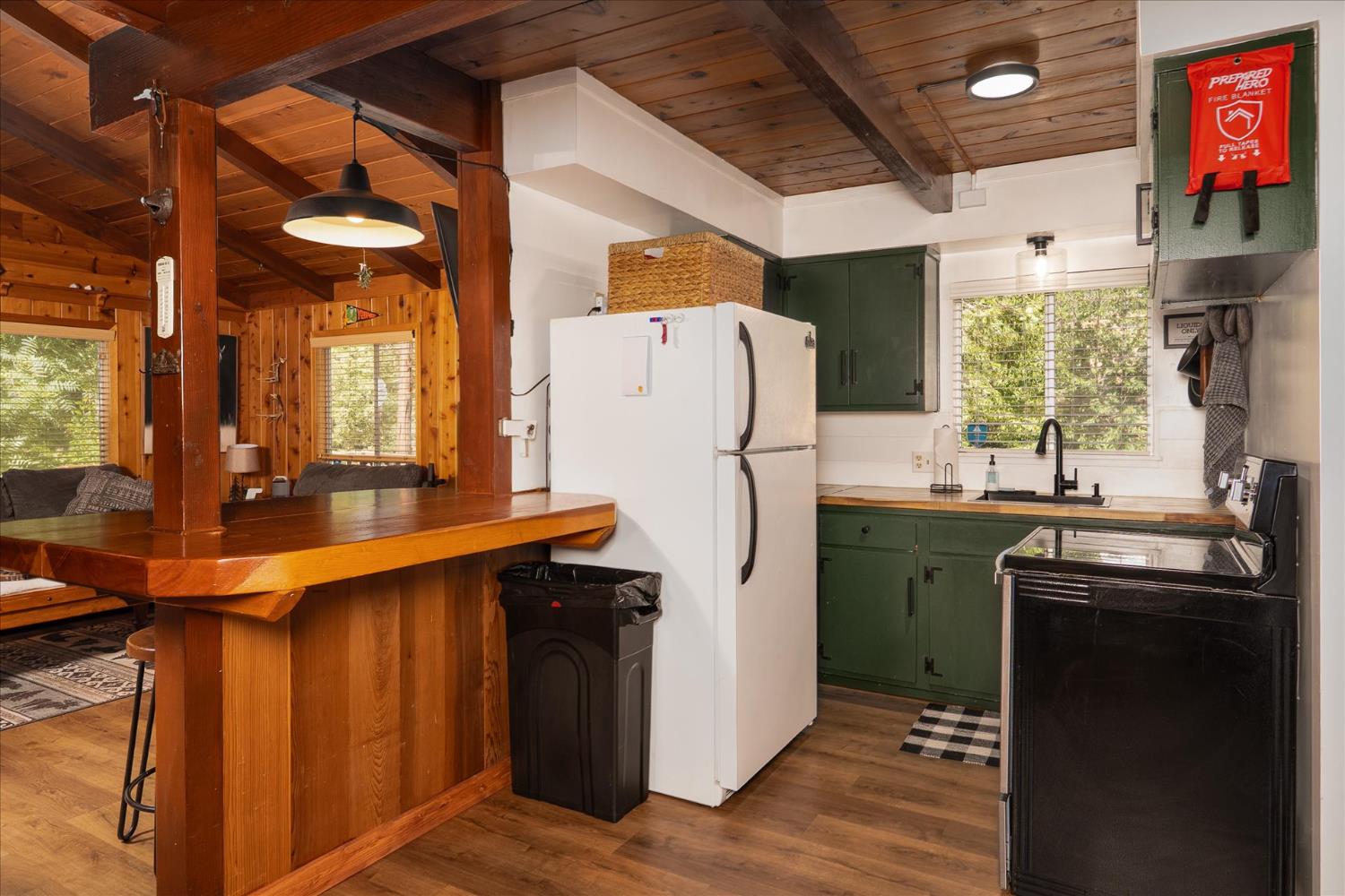 44800 Mountain Meadow Road Oakhurst, CA 93644 - Photo 8 of 41 a kitchen with refrigerator and window