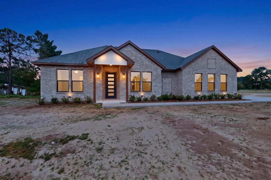 4737 Pine Ridge Court Athens, TX 75752 - Photo 1 of 26 a front view of a house with a yard