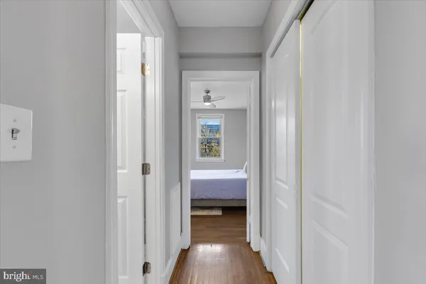 a view of bedroom with wooden floor