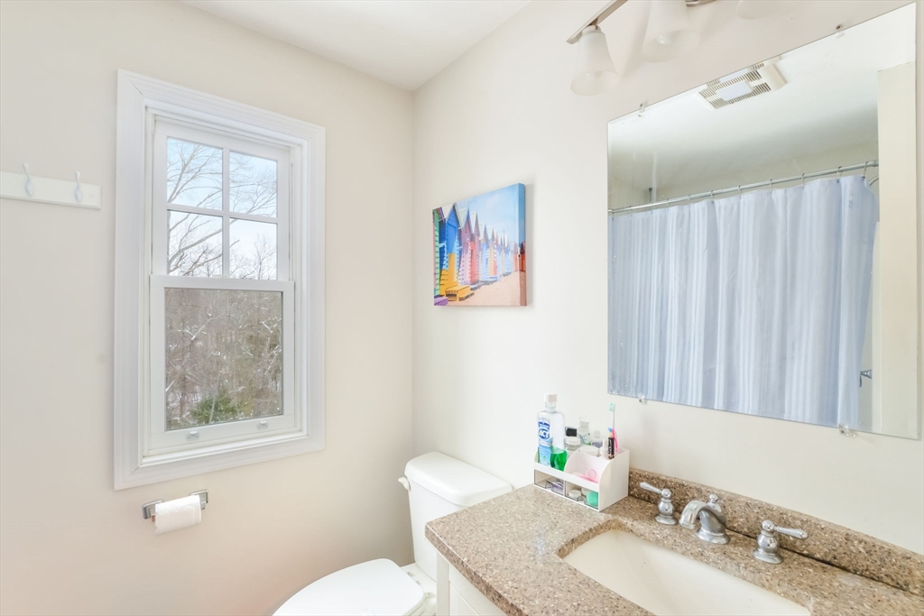 63 Wareham Street Middleboro, MA 02346 - Photo 12 of 23 a bathroom with a granite countertop sink a toilet and a mirror