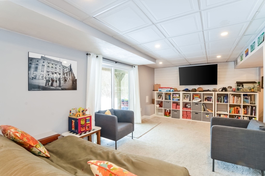 63 Wareham Street Middleboro, MA 02346 - Photo 14 of 23 a living room with furniture and a flat screen tv