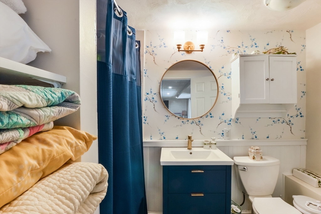 63 Wareham Street Middleboro, MA 02346 - Photo 17 of 23 a bathroom with a sink and a mirror