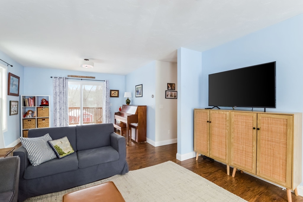 63 Wareham Street Middleboro, MA 02346 - Photo 3 of 23 a living room with furniture and a flat screen tv