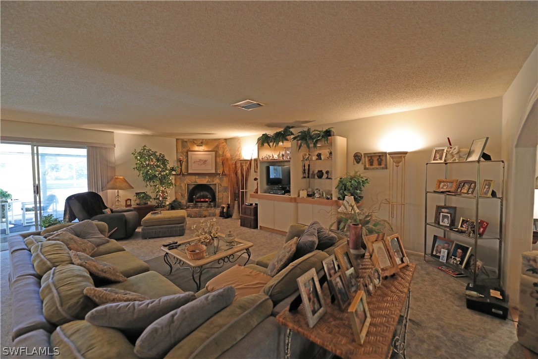 14430 Cemetery Road Fort Myers, FL 33905 - Photo 11 of 35 a living room with furniture a lamp and a large window