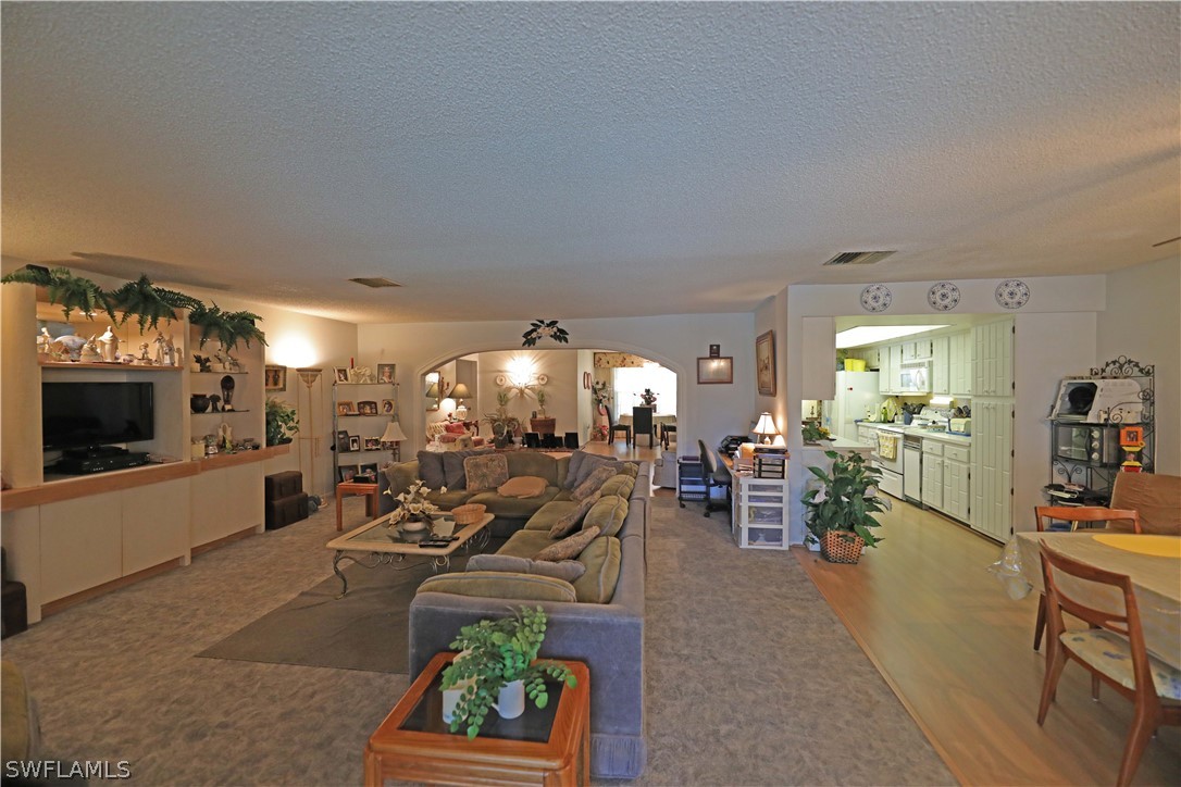 14430 Cemetery Road Fort Myers, FL 33905 - Photo 13 of 35 a living room with furniture and a flat screen tv