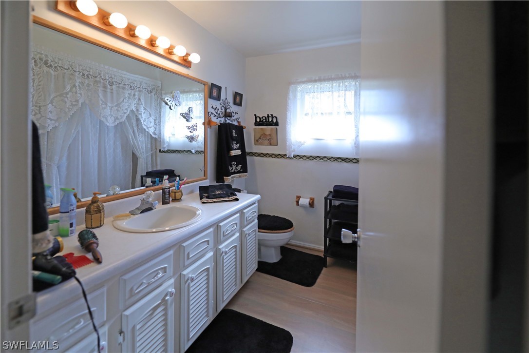 14430 Cemetery Road Fort Myers, FL 33905 - Photo 23 of 35 a bathroom with a double vanity sink and a mirror