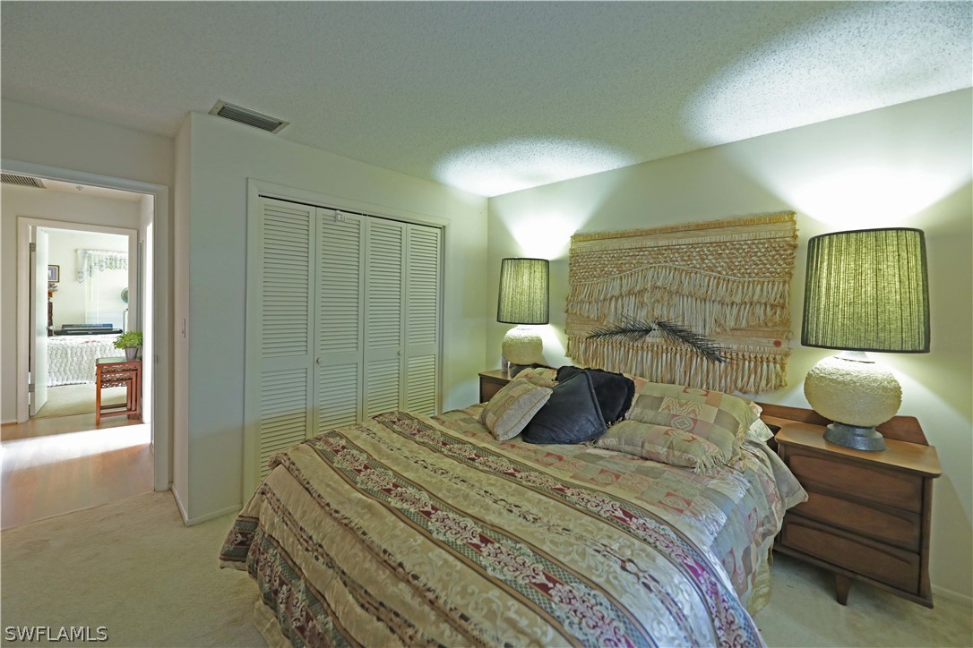 14430 Cemetery Road Fort Myers, FL 33905 - Photo 24 of 35 a bedroom with a bed and lamp