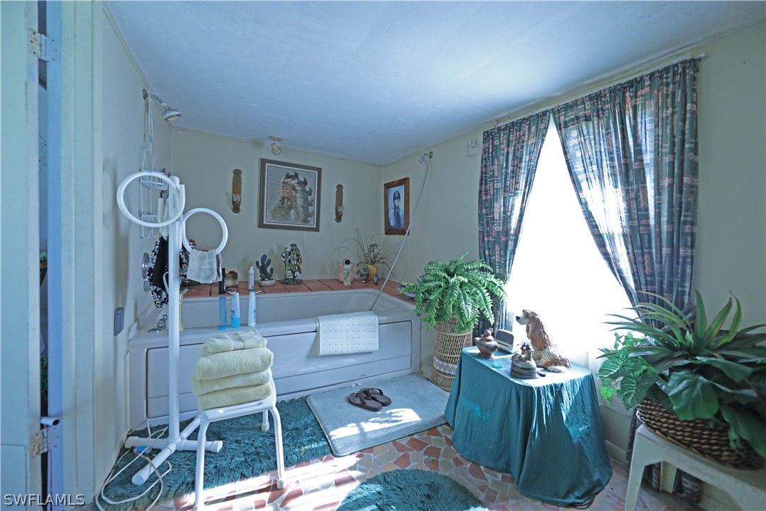 14430 Cemetery Road Fort Myers, FL 33905 - Photo 25 of 35 a living room with furniture and a large window
