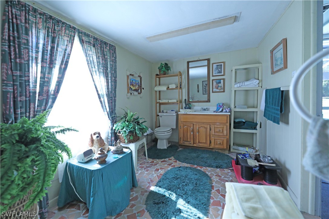 14430 Cemetery Road Fort Myers, FL 33905 - Photo 26 of 35 a living room with furniture and a window