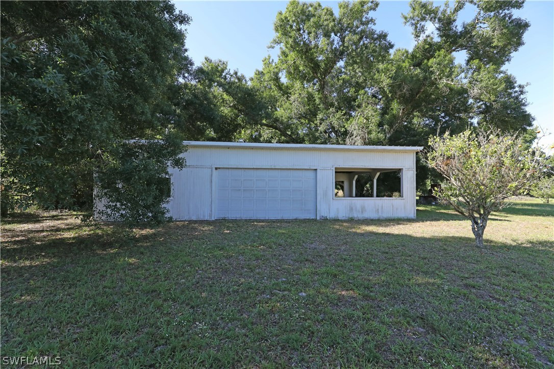 14430 Cemetery Road Fort Myers, FL 33905 - Photo 28 of 35 a view of a house with a yard