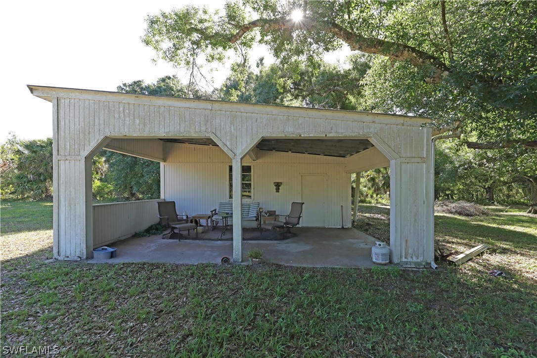 14430 Cemetery Road Fort Myers, FL 33905 - Photo 29 of 35 a view of a house with backyard and garden