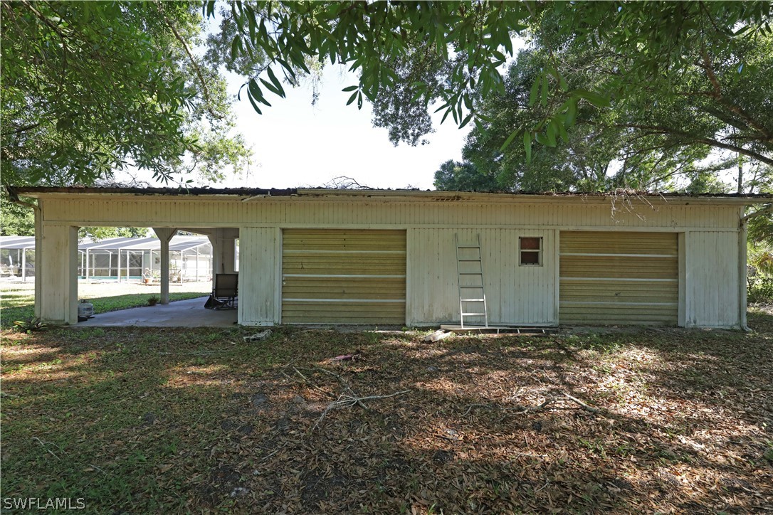 14430 Cemetery Road Fort Myers, FL 33905 - Photo 30 of 35 a view of a house with a yard