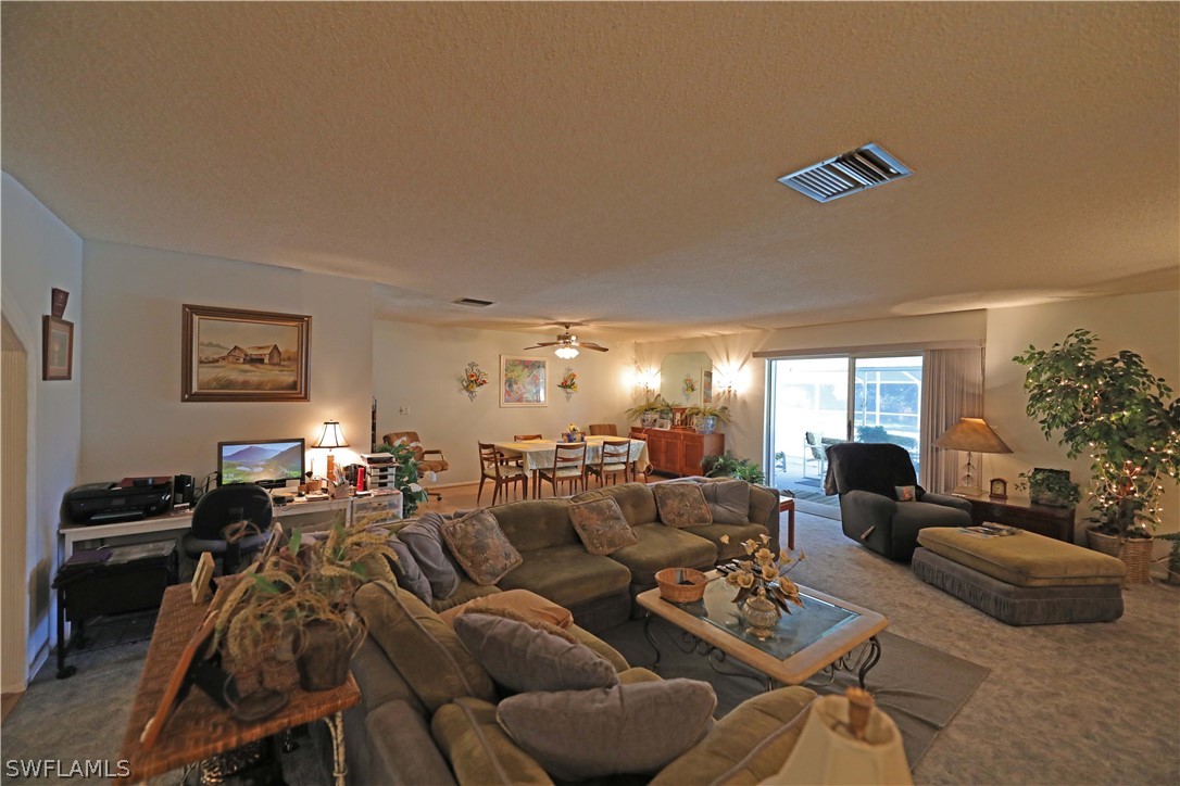 14430 Cemetery Road Fort Myers, FL 33905 - Photo 10 of 35 a living room with furniture and a large window