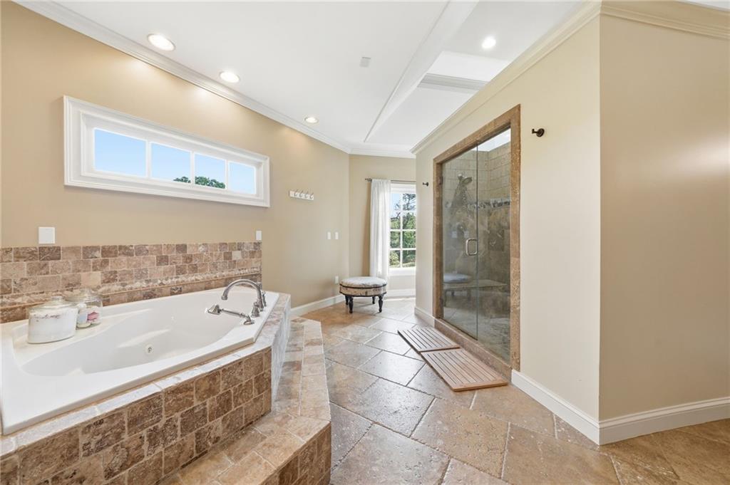 3535 Dr Bramblett Road Cumming, GA 30028 - Photo 35 of 91 a spacious bathroom with a bathtub and a sink