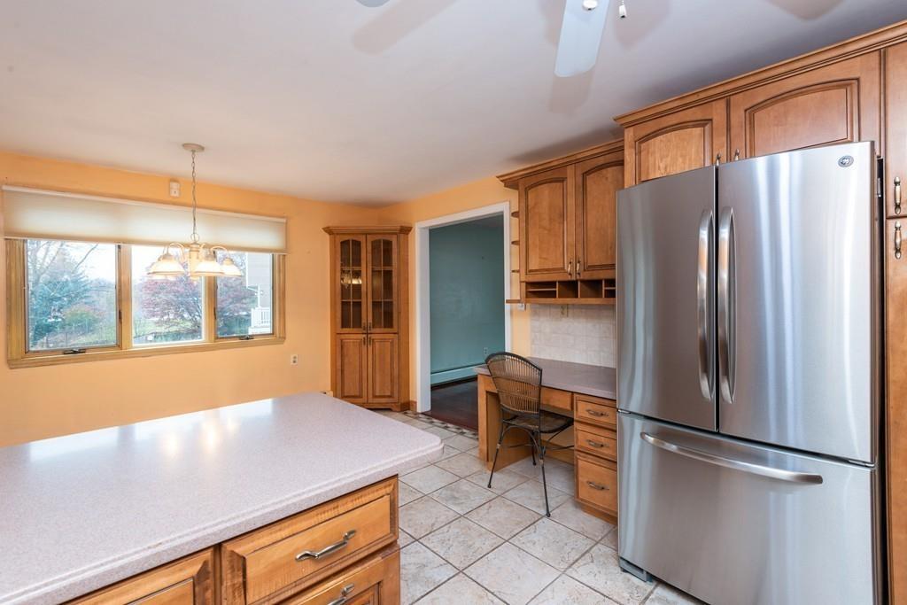 26 Doane Road Medford, MA 02155 - Photo 14 of 24 a kitchen with stainless steel appliances a refrigerator and a stove top oven
