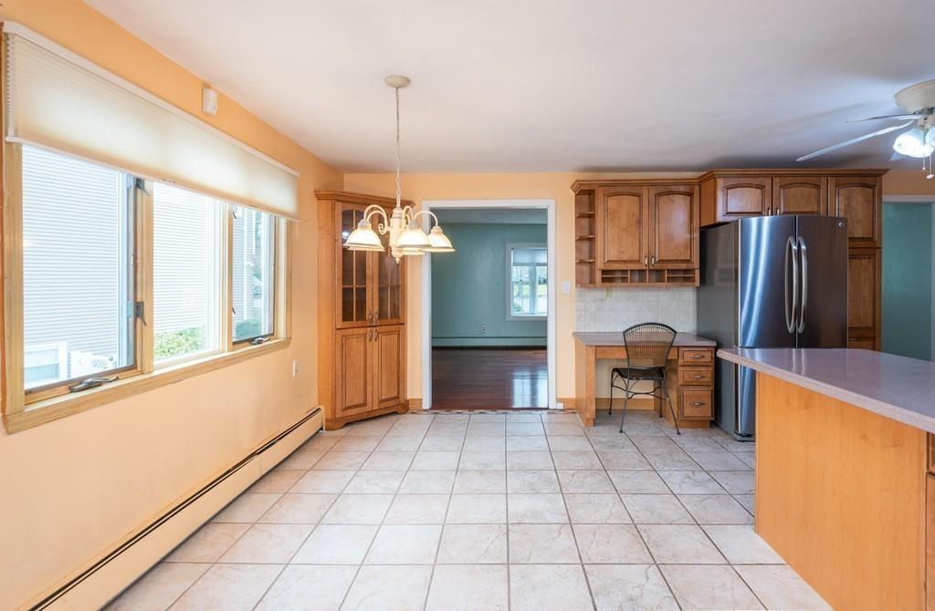 26 Doane Road Medford, MA 02155 - Photo 17 of 24 a view of a refrigerator in kitchen and an empty room