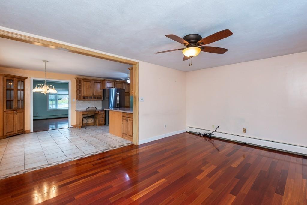 26 Doane Road Medford, MA 02155 - Photo 19 of 24 wooden floor in an empty room with a window