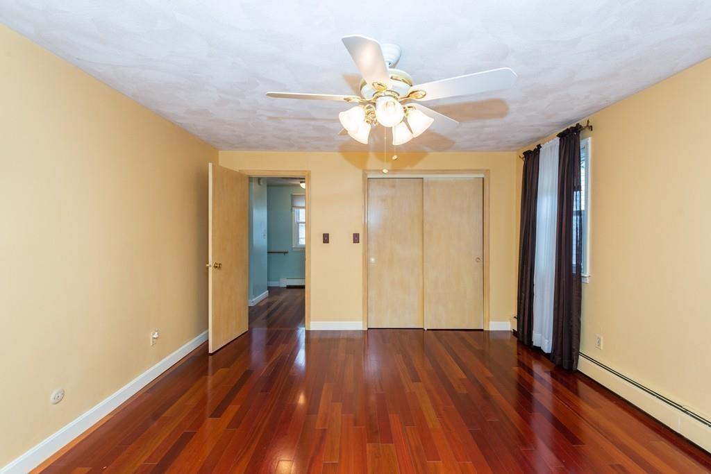 26 Doane Road Medford, MA 02155 - Photo 20 of 24 a view of an empty room with wooden floor