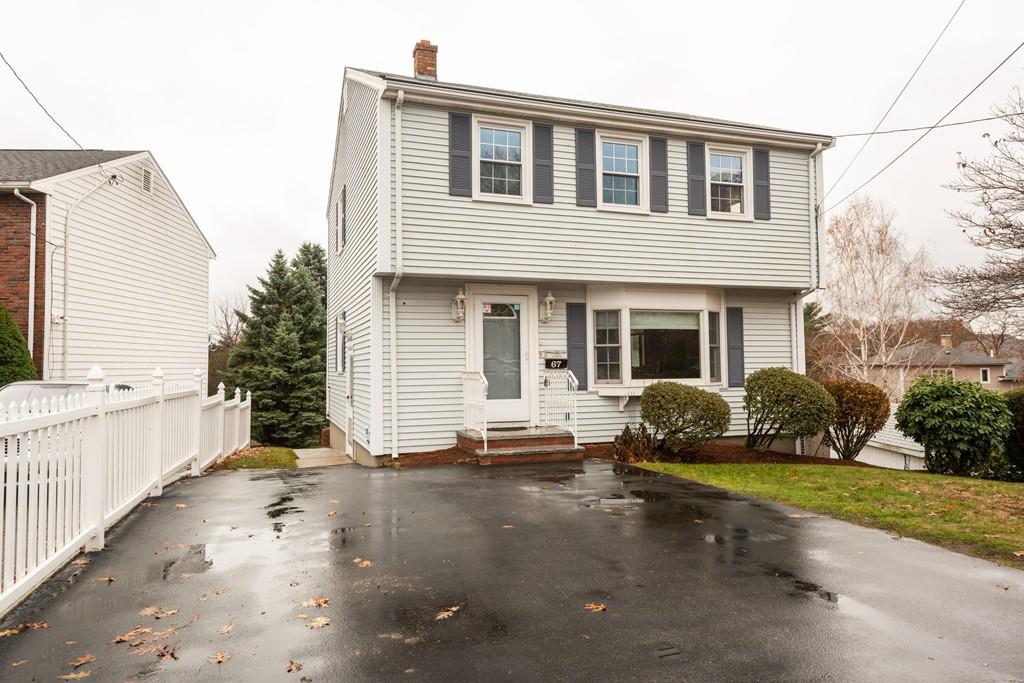 26 Doane Road Medford, MA 02155 - Photo 2 of 24 a front view of a house with a yard