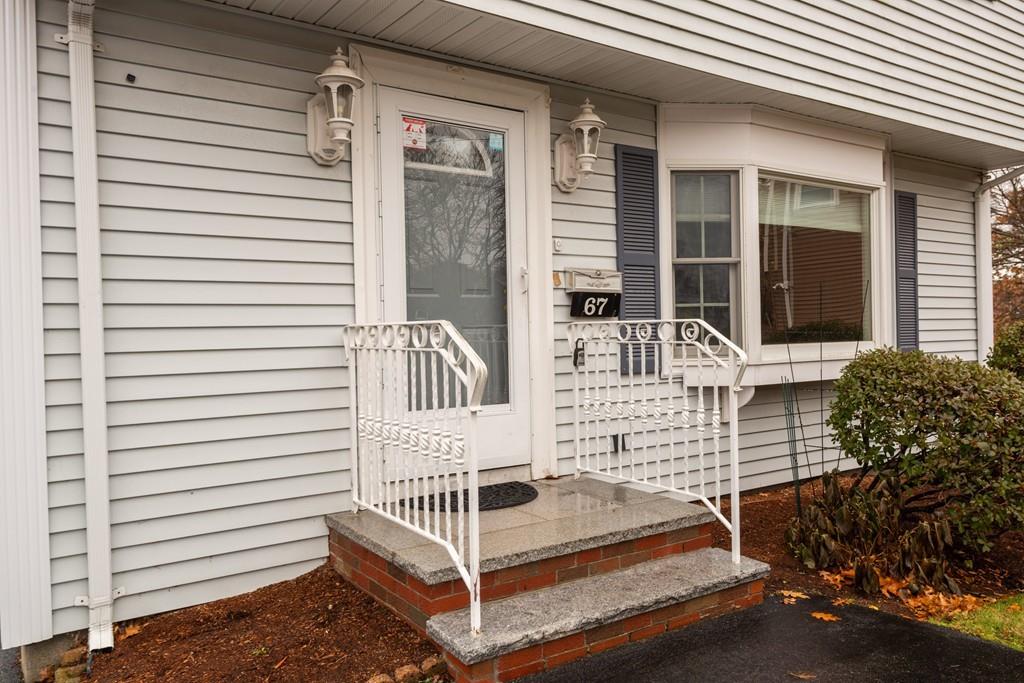 26 Doane Road Medford, MA 02155 - Photo 3 of 24 a view of balcony with two chairs and a large window
