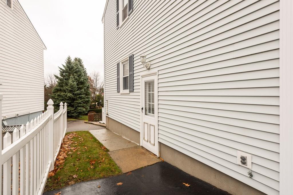 26 Doane Road Medford, MA 02155 - Photo 4 of 24 a view of a back side of house
