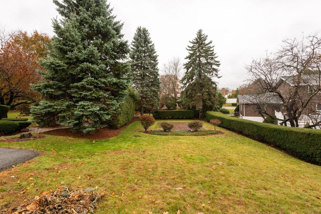26 Doane Road Medford, MA 02155 - Photo 6 of 24 a view of a swimming pool with an outdoor space