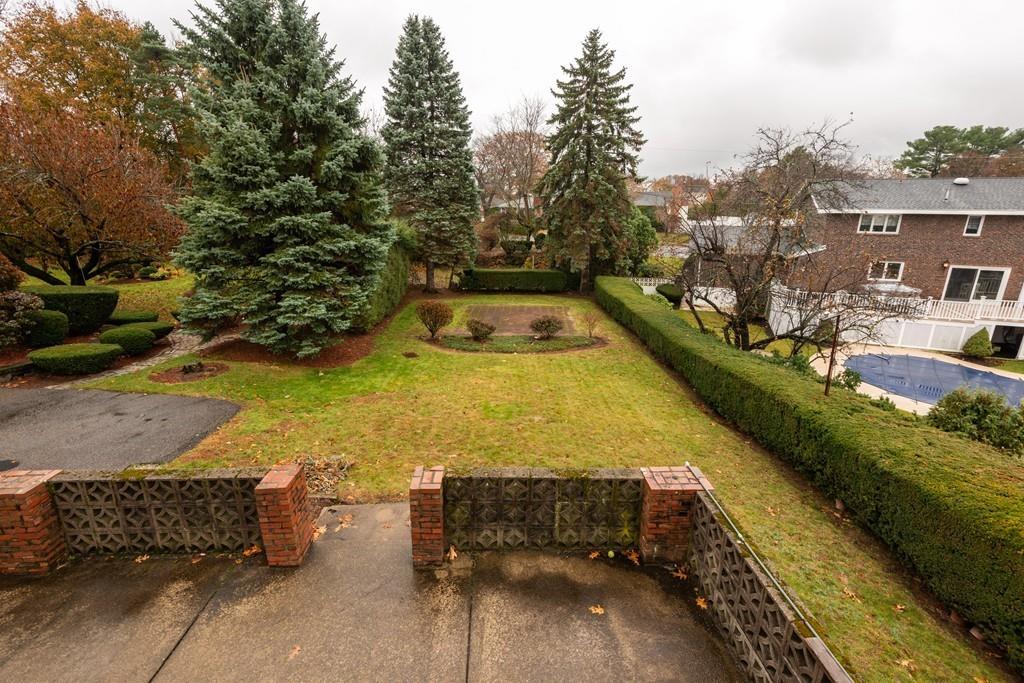 26 Doane Road Medford, MA 02155 - Photo 7 of 24 a view of a backyard with swimming pool