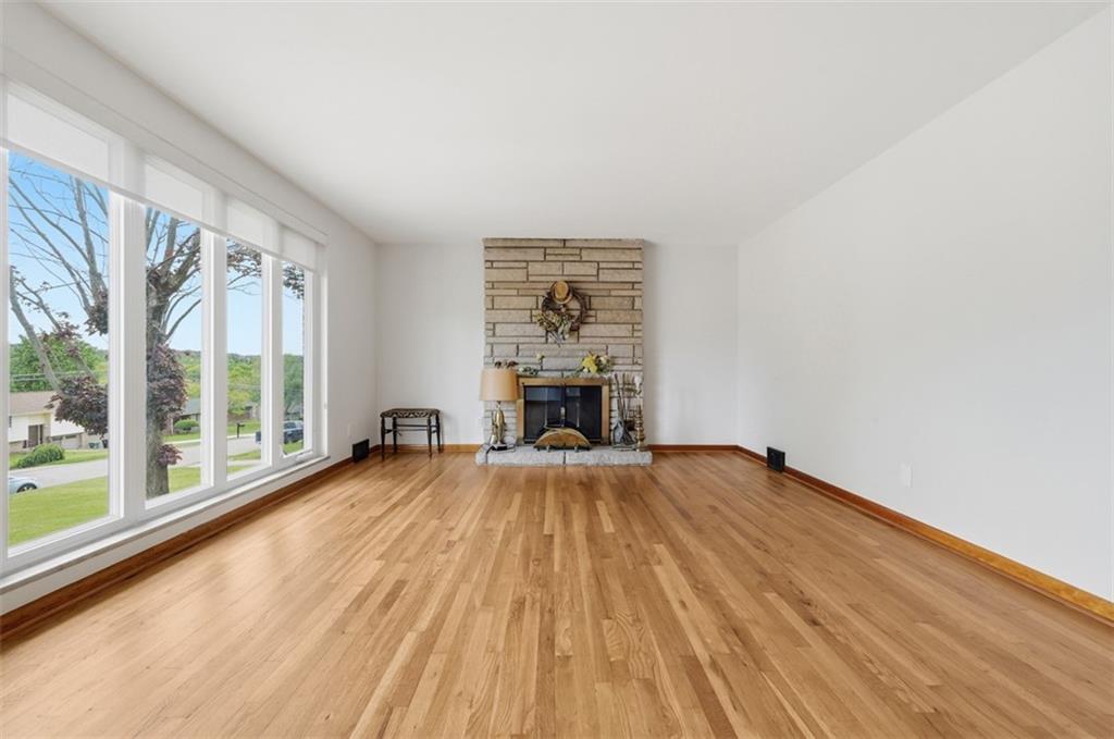 6 Greenview Drive McKees Rocks, PA 15136 - Photo 11 of 44 a view of empty room with wooden floor and fireplace