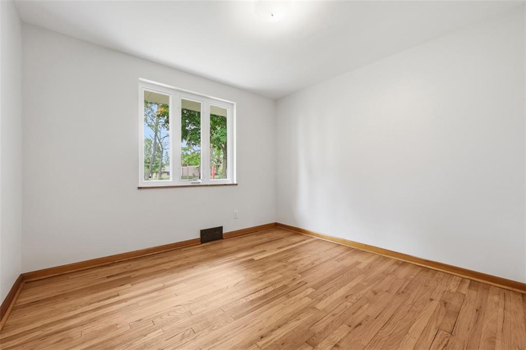 6 Greenview Drive McKees Rocks, PA 15136 - Photo 13 of 44 a view of an empty room with wooden floor and a window
