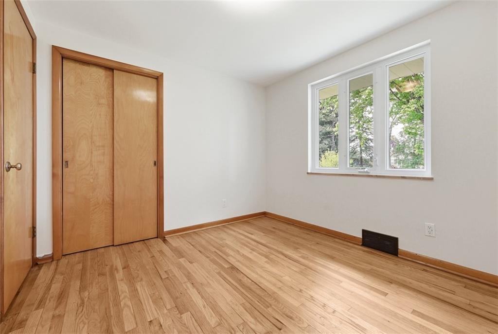 6 Greenview Drive McKees Rocks, PA 15136 - Photo 14 of 44 a view of an empty room with wooden floor and a window