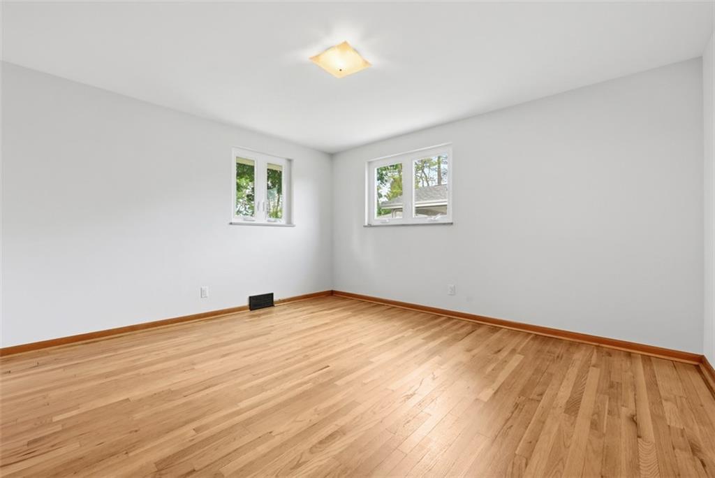 6 Greenview Drive McKees Rocks, PA 15136 - Photo 15 of 44 a view of an empty room with wooden floor and a window