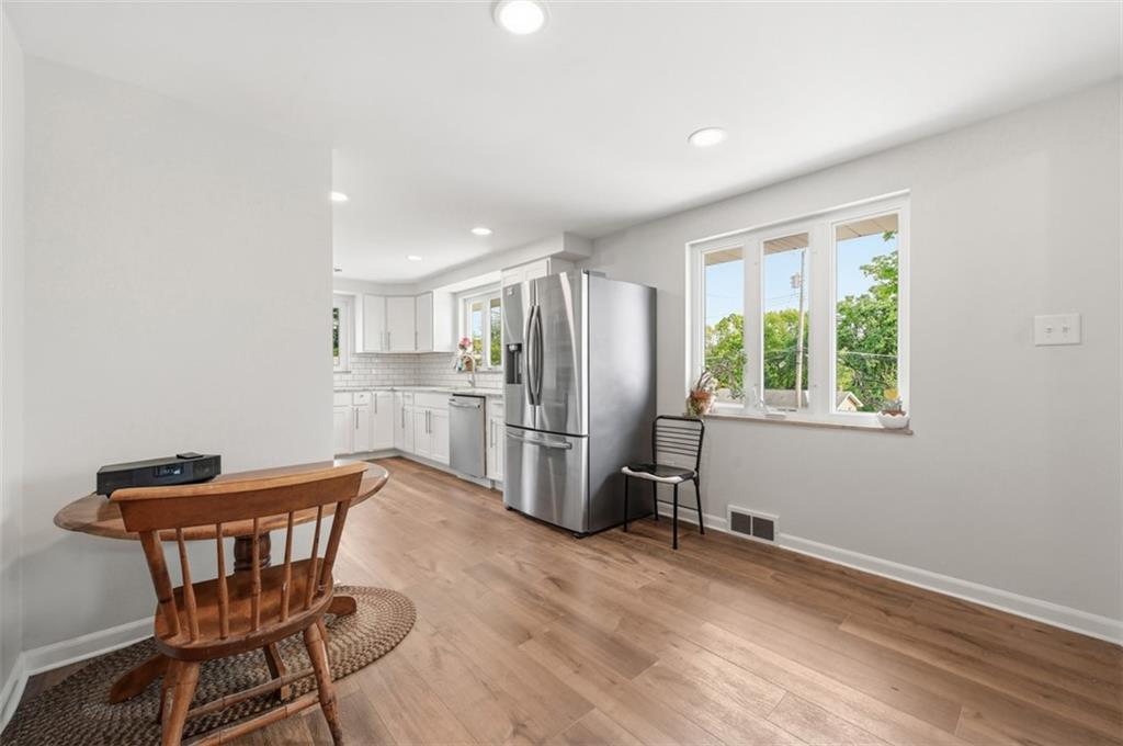 6 Greenview Drive McKees Rocks, PA 15136 - Photo 22 of 44 a kitchen with stainless steel appliances wooden floor and chair