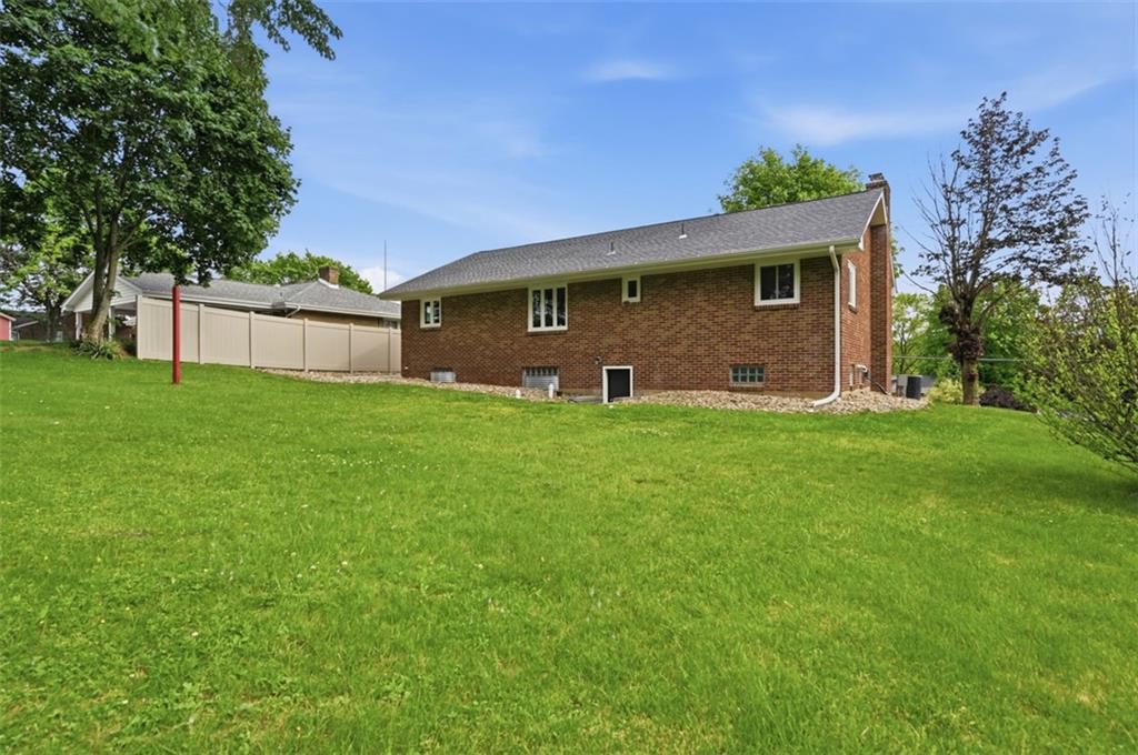 6 Greenview Drive McKees Rocks, PA 15136 - Photo 33 of 44 a front view of house with yard and trees in the background