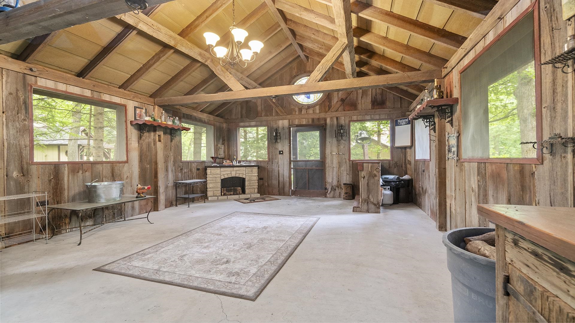 10289 Flory Road Lanark, IL 61046 - Photo 41 of 45 a view of a large room with wooden floor and windows