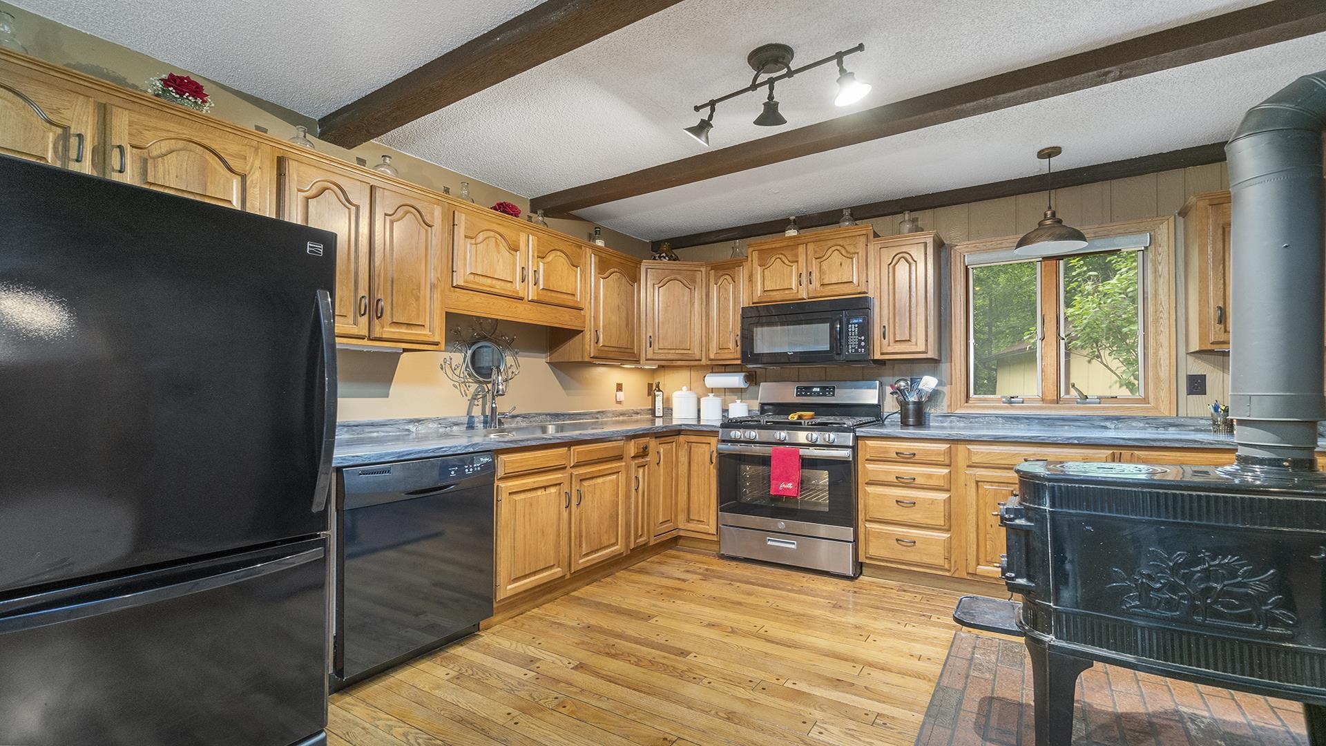 10289 Flory Road Lanark, IL 61046 - Photo 7 of 45 a kitchen with stainless steel appliances granite countertop a stove sink and cabinets