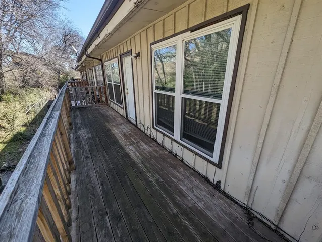a view of balcony with wooden floor