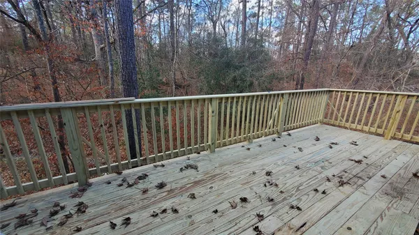 a view of balcony with wooden floor
