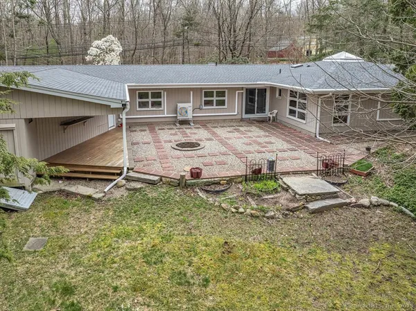 an aerial view of a house with yard