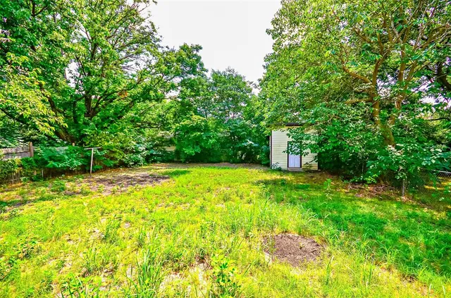 a backyard of a house with lots of green space