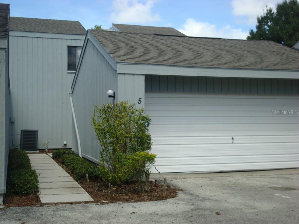1502 Lake Buckeye Road, Unit 5 Winter Haven, FL 33881 - Photo 1 of 1 a view of house with garage