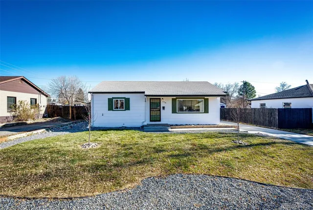a view of a house with swimming pool and a yard