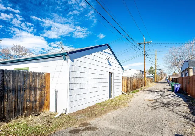 a view of a backyard with a small cabin